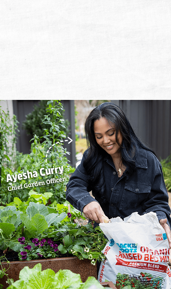 Ayesha Curry gardening with Back to the Roots organic raised bed mix.