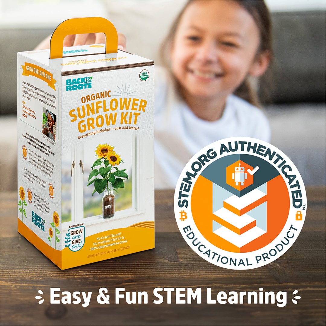 Organic Sunflower Grow Kit box with bright sunflower image and orange handle, child smiling blurred in background. - Organic Sunflower Windowsill Grow Kit 🌻 - Default Title - Back to the Roots