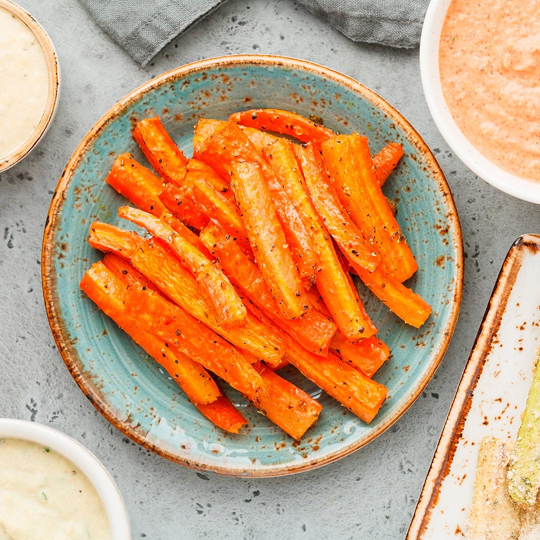 Roasted carrot sticks seasoned with spices on a blue ceramic plate. - Organic Carrot Seeds — 'Scarlet Nantes' - Default Title - Back to the Roots