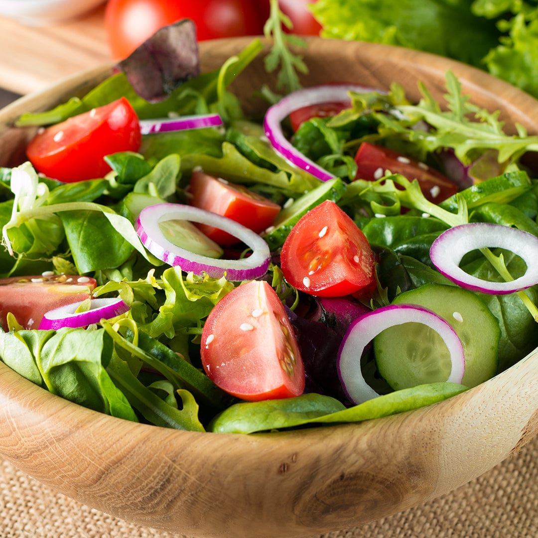 Wooden bowl filled with fresh mixed greens salad, cherry tomatoes, and sliced red onions. - Organic Mesclun Seeds — 'Gourmet Salad Mix' - Default Title - Back to the Roots