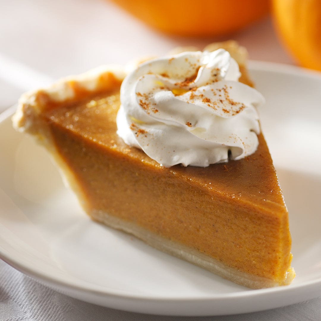 Slice of smooth pumpkin pie with whipped cream and cinnamon on white plate. - Organic Pumpkin Seeds — 'Small Sugar' - Default Title - Back to the Roots