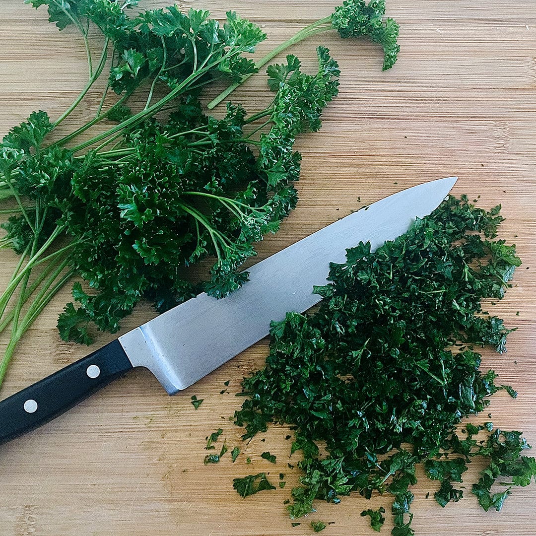Fresh moss curled parsley bunch and finely chopped parsley on wooden cutting board with chef knife. - Organic Parsley Seeds — 'Moss Curled' - Default Title - Back to the Roots