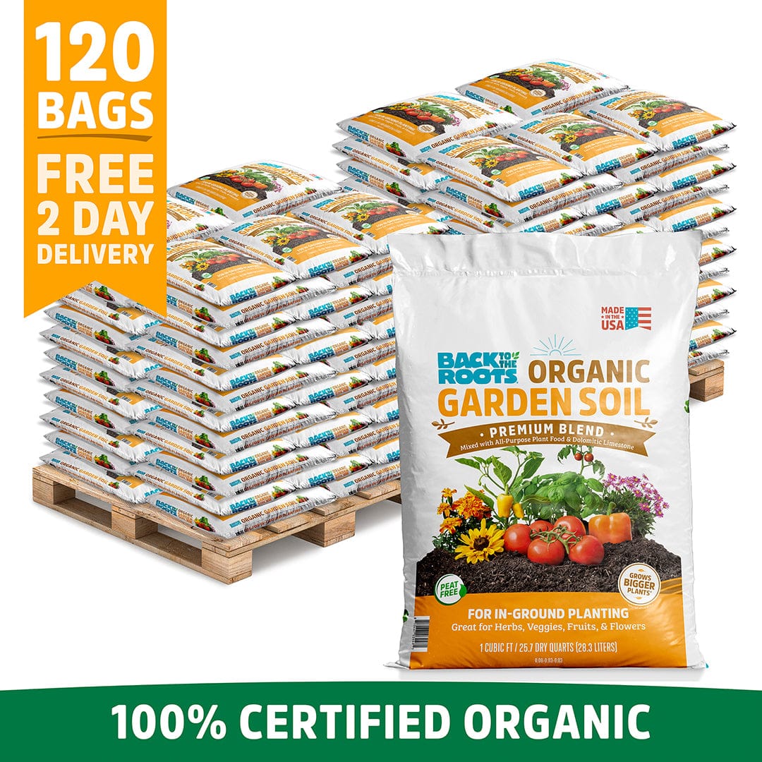 Stack of 120 white bags of organic garden soil with colorful vegetable graphics on front, displayed on wooden pallets. - Organic Bulk Garden Soil (120 1 cu. ft. Bags) - Default Title - Back to the Roots