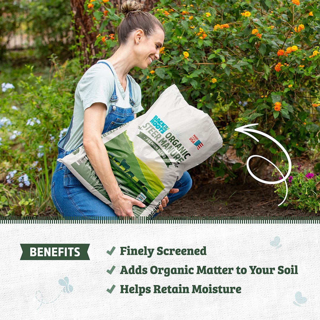 Woman holding a white and green 1 cu.ft. bag of organic bulk steer manure with garden background and benefits text below. - Organic Bulk Steer Manure (30 1 cu.ft. Bags) - Default Title - Back to the Roots