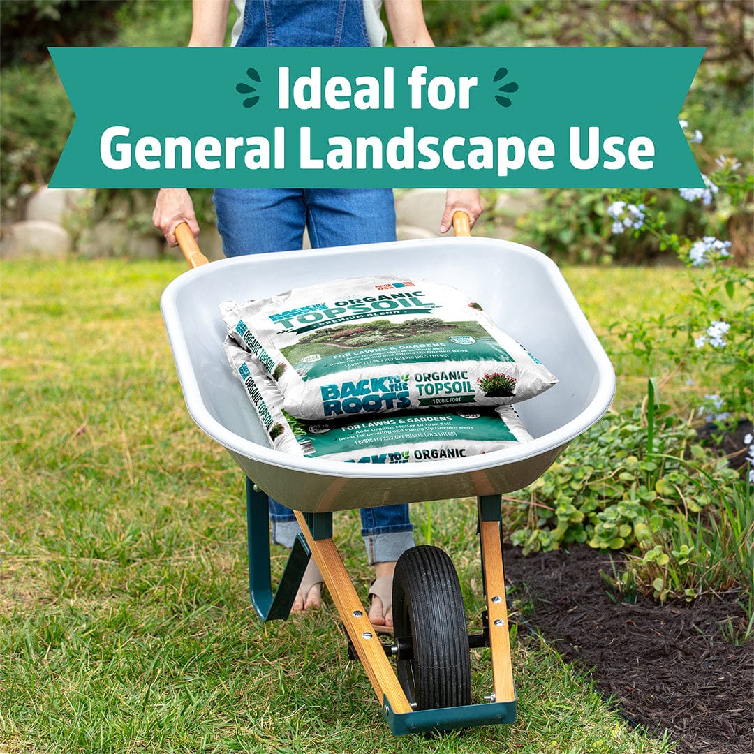 White plastic wheelbarrow with wooden handles and a black wheel holding stacked rectangular bags of organic bulk topsoil. - Organic Bulk Topsoil (30 1 cu.ft. Bags) - Default Title - Back to the Roots