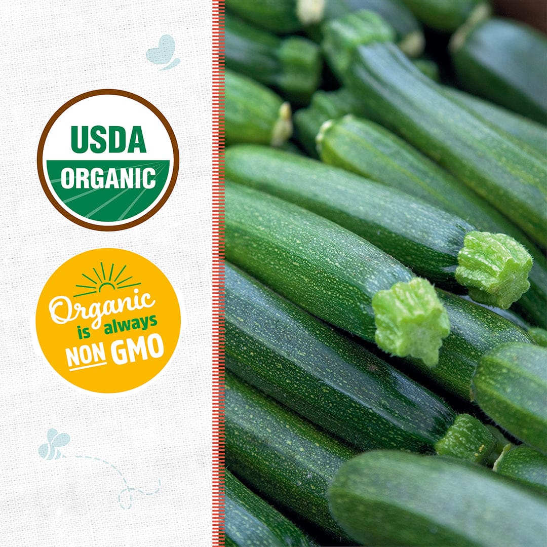 Close-up of fresh green zucchini with USDA Organic and Non-GMO certification badges on white background. - Organic Zucchini Seeds — 'Fordhook' • Summer Squash - Default Title - Back to the Roots