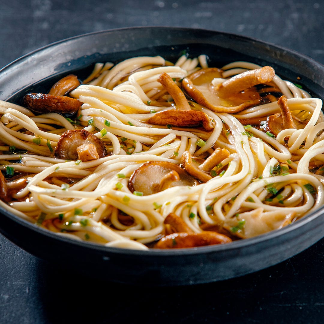 Black bowl filled with shiitake mushrooms and noodles in clear broth garnished with green herbs. - Organic Shiitake Mushroom Kit (START GROWING RIGHT AWAY) - Default Title - Back to the Roots